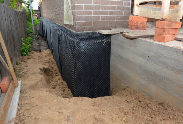 Happy homeowners after waterproofing job in Cohocton
